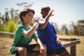 Boys drinking water after workout during obstacle course Royalty Free Stock Photo