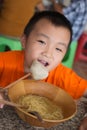 Boys eating big meatballs Royalty Free Stock Photo