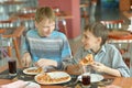 Boys eating pizza