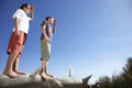 Boys On Fallen Tree Shielding Eyes Royalty Free Stock Photo