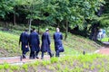 Boys Hasidic Jews, in traditional black clothes walk in the park in Uman, Ukraine, the time of the Jewish New Year, Religious