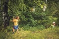 Boys fighting over girls outdoors in forest countryside childhood lifestyle Royalty Free Stock Photo