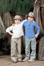 Boys - fishermen in a barn with fishing tackles