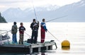 Boys fishing on fjord Royalty Free Stock Photo