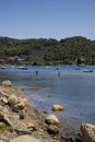 Boys fishing in the old harbour of Skiathos, Skiathos Town, Greece, August 18, 2017 Royalty Free Stock Photo