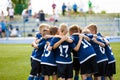 Team Sports for Kids. Children Sports Soccer Team. Coach Motivate Soccer Players to Play as a Team. Boys Kids Soccer Football Game Royalty Free Stock Photo