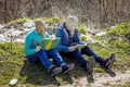 Boys in gas masks in garbage dump read books. Environmental poll