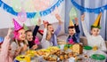 Boys and girls behaving jokingly during friend birthday party