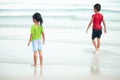 Boys and girls are happy to play in the sea. On family holidays. Royalty Free Stock Photo