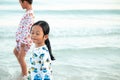 Boys and girls are happy to play in the sea. On family holidays. Royalty Free Stock Photo