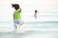 Boys and girls are happy to play in the sea. On family holidays. Royalty Free Stock Photo