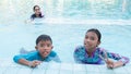 Boys and girls have fun playing in the pool, In the summer and on holidays Royalty Free Stock Photo