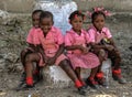 Kindergartners in pink rest during heat of day in Robillard, Haiti. Royalty Free Stock Photo