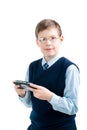 Boys hand playing portable video game Royalty Free Stock Photo