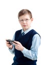 Boys hand playing portable video game i Royalty Free Stock Photo