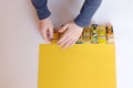 Boys hands plays little yellow cars Royalty Free Stock Photo