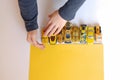 Boys hands plays little yellow cars Royalty Free Stock Photo