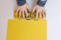 Boys hands plays little yellow cars Royalty Free Stock Photo