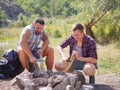 Boys hands start fire with magnesium fire steel, fire striker. Royalty Free Stock Photo