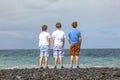 Boys have fun at the black volcanic beach Royalty Free Stock Photo