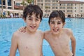 The Boys are Have Fun in the Swimming Pool Royalty Free Stock Photo