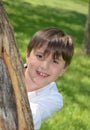 Boys Head Behind Tree Royalty Free Stock Photo