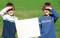 Boys Holding Sign