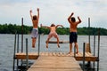 Boys jumping into lake Royalty Free Stock Photo