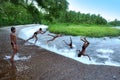 Boys jumping on lake water Royalty Free Stock Photo