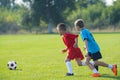 Boys kicking ball