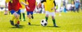 Boys kicking football soccer match.Youth football league Royalty Free Stock Photo