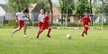 Boys kicking football