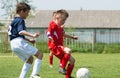 Boys kicking football