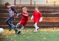 Boys kicking football