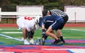 Boys Lacrosse faceoff at midfield during a high school game Royalty Free Stock Photo