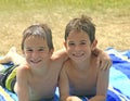 Boys Laying on Beach Towels Royalty Free Stock Photo