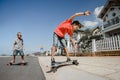 Boys on longboard skate Royalty Free Stock Photo