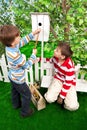 Boys make a birdhouse for the birds Royalty Free Stock Photo