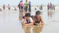 boys men people enjoying bathe sea beach waves jumping swimming