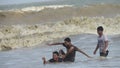 boys men people enjoying bathe sea beach waves jumping swimming