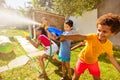 Boys in the middle of water gun fight action game Royalty Free Stock Photo