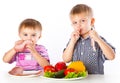 Boys and plates of vegetables and meat