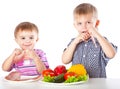 Boys and plates of vegetables and meat