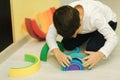 Boys play in different intelectual games in preschool classroom