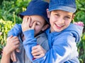 Boys play fighting in the garden Royalty Free Stock Photo