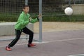 Boys play football in the schoolyard