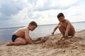 Boys play on sandy beach of Lake Seliger