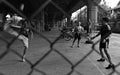 Boys play sepak takraw on streets of Bangkok