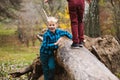 Boys play with tree trunk in forest Royalty Free Stock Photo