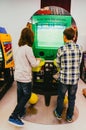 Boys playing arcade game